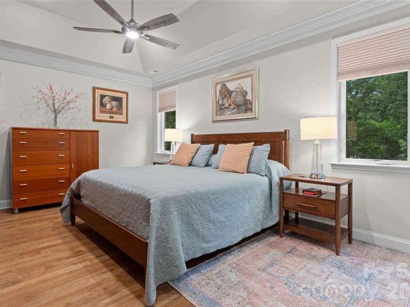5106 Silver Trace Lane, Denver, NC 28037.  MLS# CAR4393759, YatesRealty ID 34012. Spacious primary suite with tray ceiling and windows which overlook for woods.