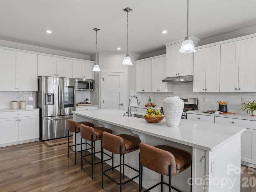 703 Dogwood Creek Lane, Indian Trail, NC 28079.  MLS# CAR4389339, YatesRealty ID 34043. Beautiful white updated kitchen