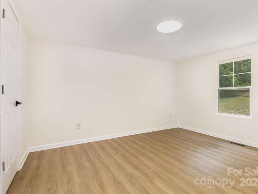 12180A Coyle Road, Stanfield, NC 28163.  MLS# CAR4294733, YatesRealty ID 34044. Bedroom with walk in closet