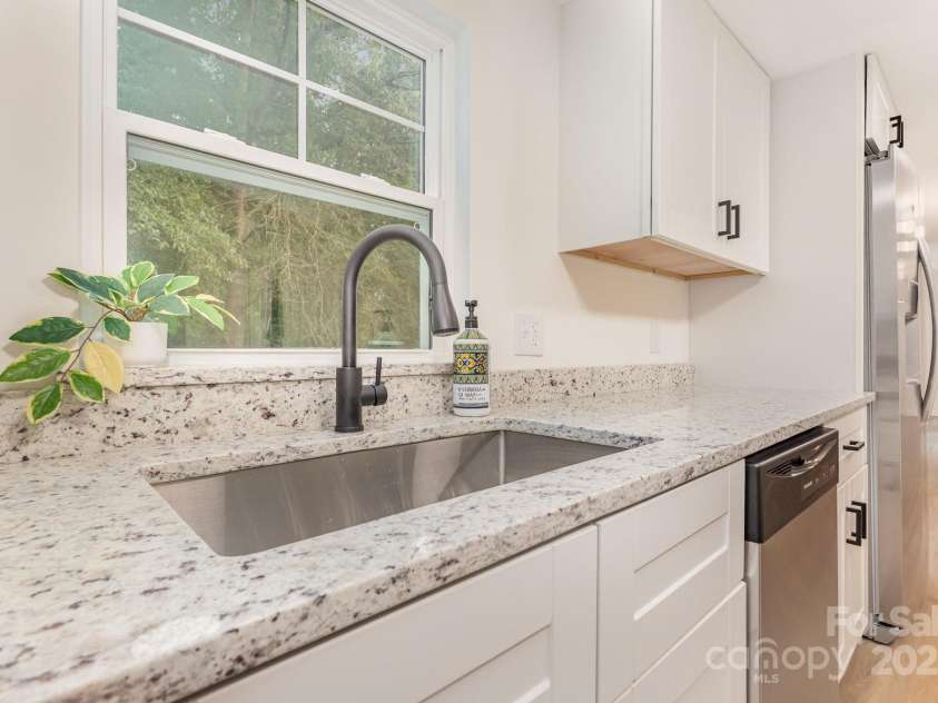 12180A Coyle Road, Stanfield, NC 28163.  MLS# CAR4294733, YatesRealty ID 34044. Granite countertops and white cabinets