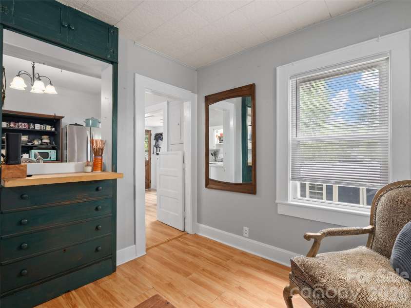 15 Craig Circle, Asheville, NC 28805.  MLS# CAR4395513, YatesRealty ID 34050. Custom built-in bar and pass-through to kitchen