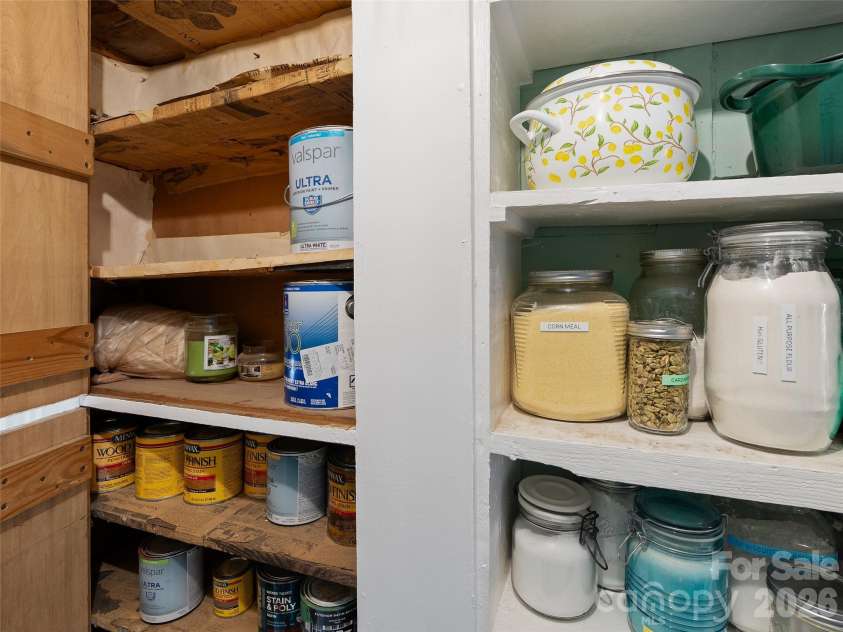 15 Craig Circle, Asheville, NC 28805.  MLS# CAR4395513, YatesRealty ID 34050. Shelves are lined in 1920s advertisements!