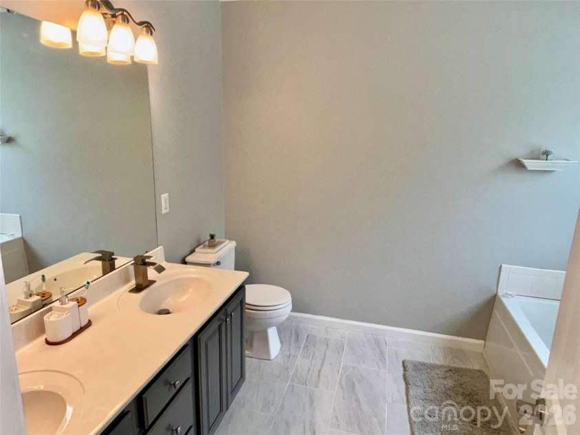 229 17th Avenue, Hickory, NC 28602.  MLS# CAR4396861, YatesRealty ID 34051. Main level Primary Bath