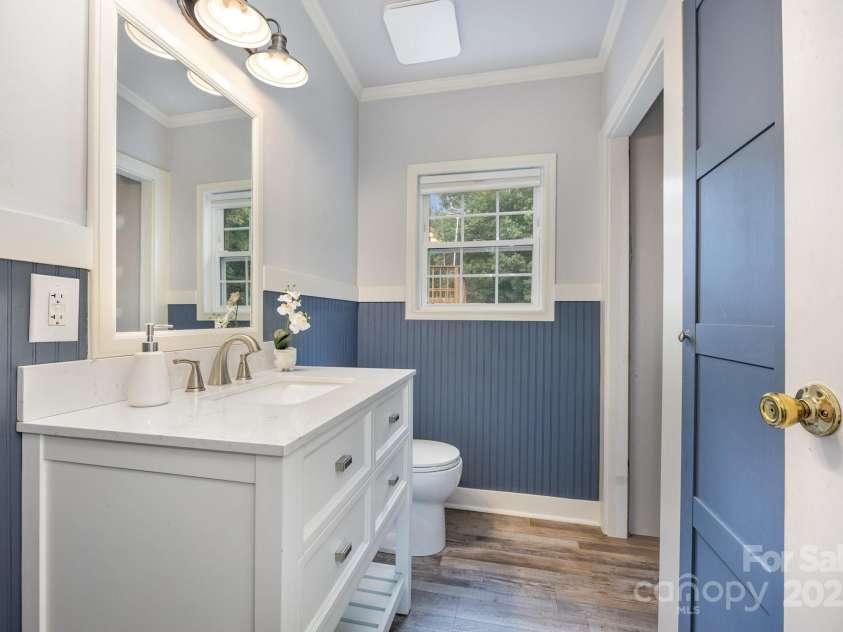 115 Trails End Lane, New London, NC 28127.  MLS# CAR4281214, YatesRealty ID 34059. 1/2 guest bath with washer/dryer