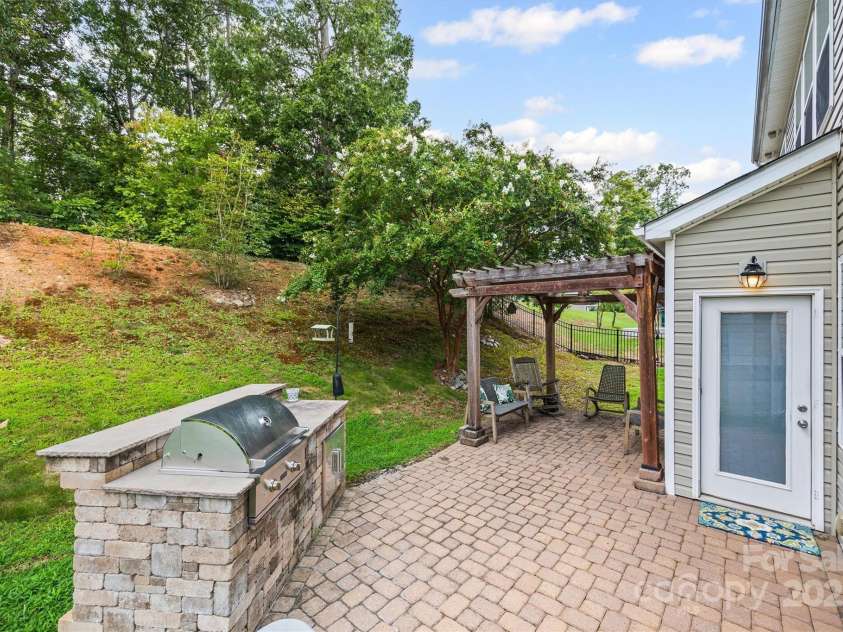 6030 Thorburn Way, Belmont, NC 28012.  MLS# CAR4292026, YatesRealty ID 34061. Built-In Grill, Patio, & Pergola w/ Drop Down Shade