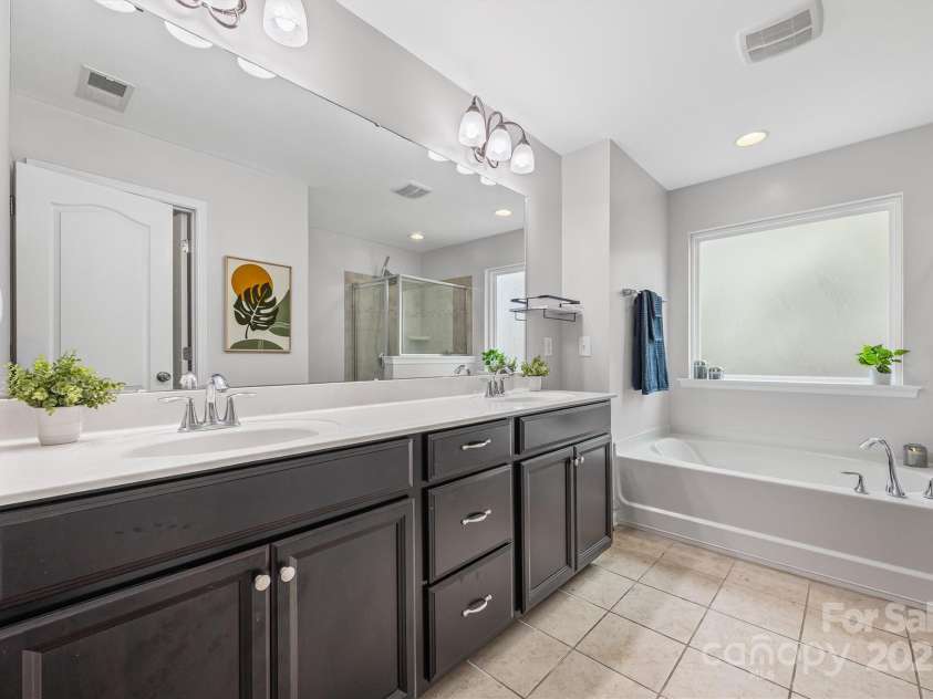 6030 Thorburn Way, Belmont, NC 28012.  MLS# CAR4292026, YatesRealty ID 34061. Spacious Primary Bath w/ Dual Sinks