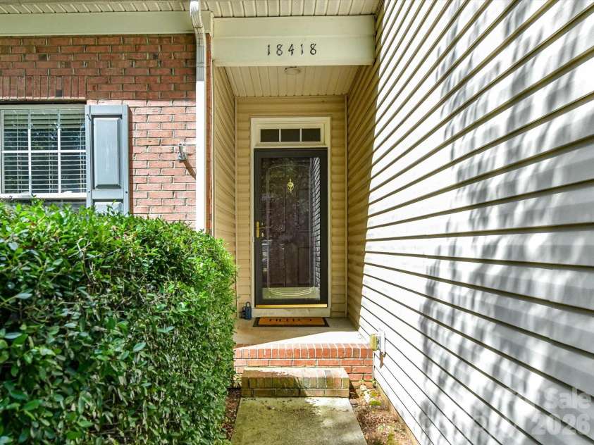 18418 Torrence Chapel Estates Circle, Cornelius, NC 28031.  MLS# CAR4392160, YatesRealty ID 34069. A charming covered entryway welcomes you home, offering a warm first impression and inviting guests into this beautifully maintained residence.