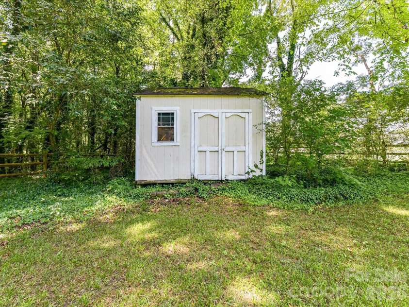 18418 Torrence Chapel Estates Circle, Cornelius, NC 28031.  MLS# CAR4392160, YatesRealty ID 34069. A detached storage shed provides convenient space for tools, lawn equipment, seasonal items, and additional outdoor storage needs.