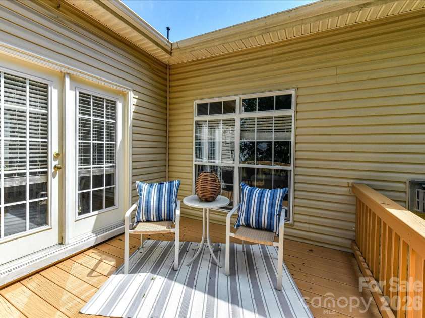 18418 Torrence Chapel Estates Circle, Cornelius, NC 28031.  MLS# CAR4392160, YatesRealty ID 34069. Enjoy outdoor living on the spacious back deck overlooking a private, tree-lined backyard, perfect for relaxing, dining, or entertaining guests.
