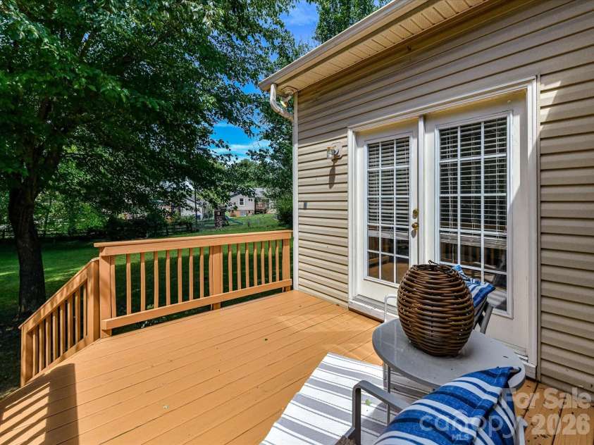 18418 Torrence Chapel Estates Circle, Cornelius, NC 28031.  MLS# CAR4392160, YatesRealty ID 34069. Enjoy outdoor living on the spacious back deck overlooking a private, tree-lined backyard, perfect for relaxing, dining, or entertaining guests.
