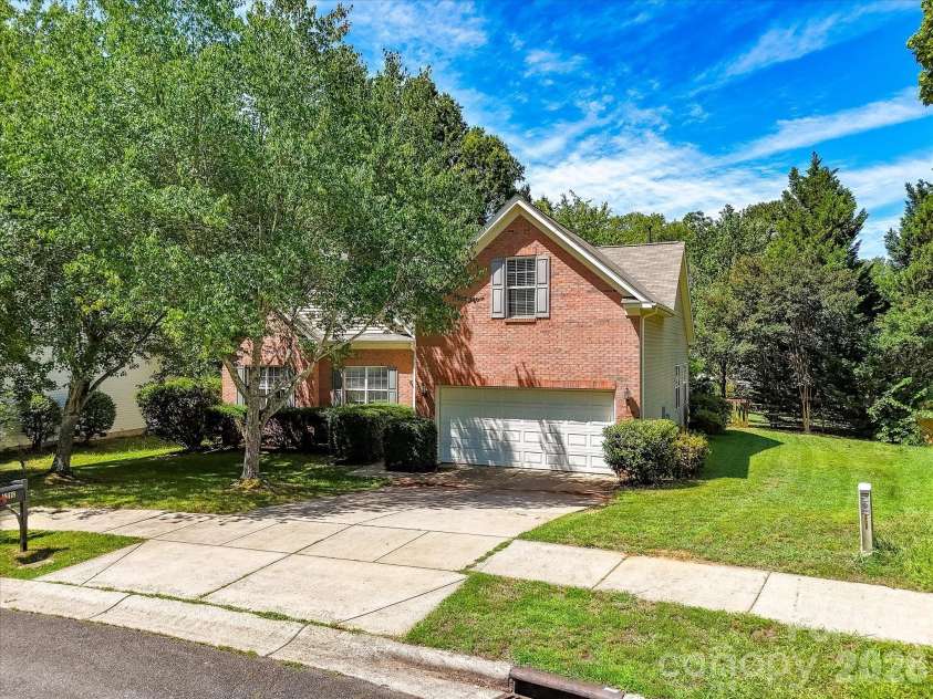 18418 Torrence Chapel Estates Circle, Cornelius, NC 28031.  MLS# CAR4392160, YatesRealty ID 34069. This attractive brick-front home features mature landscaping, a two-car garage, and a spacious lot nestled among established trees in a peaceful neighborhood setting.