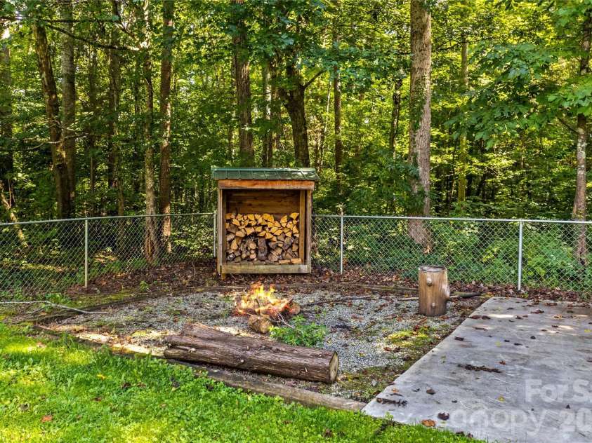215 Meadow Lake Drive, Salisbury, NC 28146.  MLS# CAR4291335, YatesRealty ID 3407. Firepit area with wood storage shed!