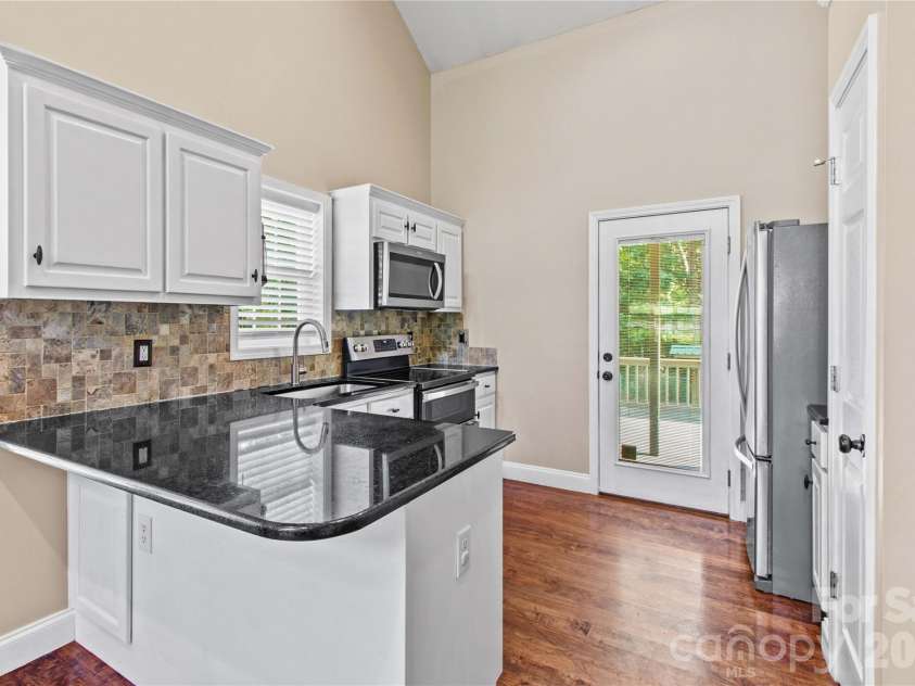 215 Meadow Lake Drive, Salisbury, NC 28146.  MLS# CAR4410309, YatesRealty ID 3407. Kitchen has access to back porch for easy grilling!