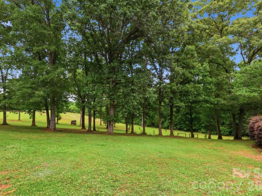 8301 Waxhaw Creek Road, Waxhaw, NC 28173.  MLS# CAR4393275, YatesRealty ID 34071. Back yard off rear deck