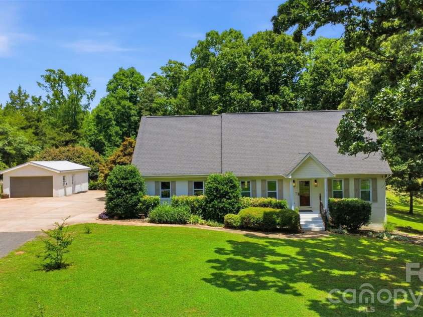 8301 Waxhaw Creek Road, Waxhaw, NC 28173.  MLS# CAR4393275, YatesRealty ID 34071. Front with detached garage