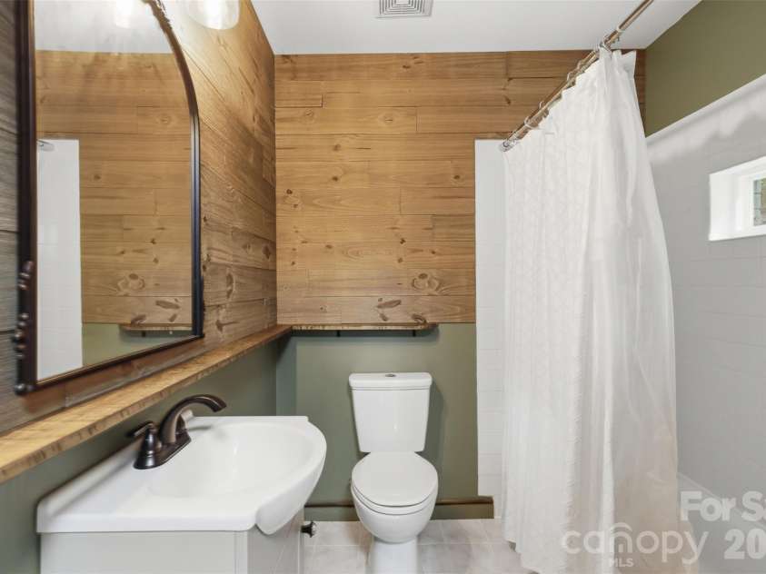 8301 Waxhaw Creek Road, Waxhaw, NC 28173.  MLS# CAR4393275, YatesRealty ID 34071. Full bath on main level near kitchen and laundry