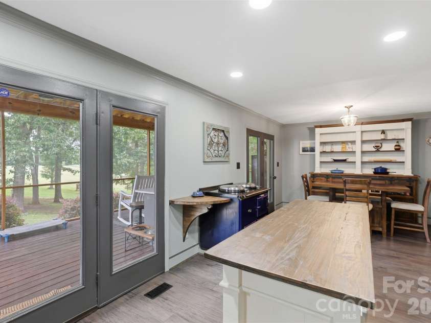 8301 Waxhaw Creek Road, Waxhaw, NC 28173.  MLS# CAR4393275, YatesRealty ID 34071. Kitchen island and breakfast nook