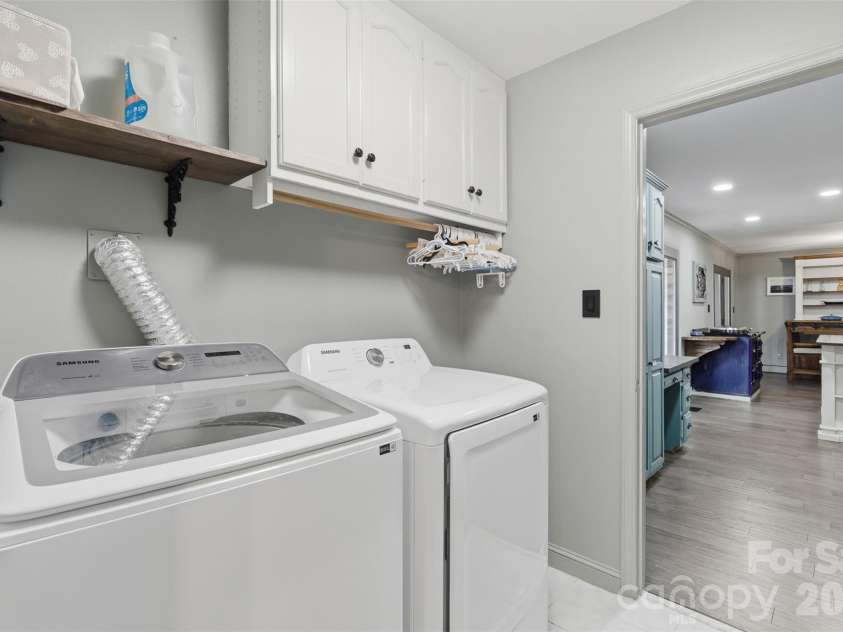 8301 Waxhaw Creek Road, Waxhaw, NC 28173.  MLS# CAR4393275, YatesRealty ID 34071. Laundry main level near kitchen