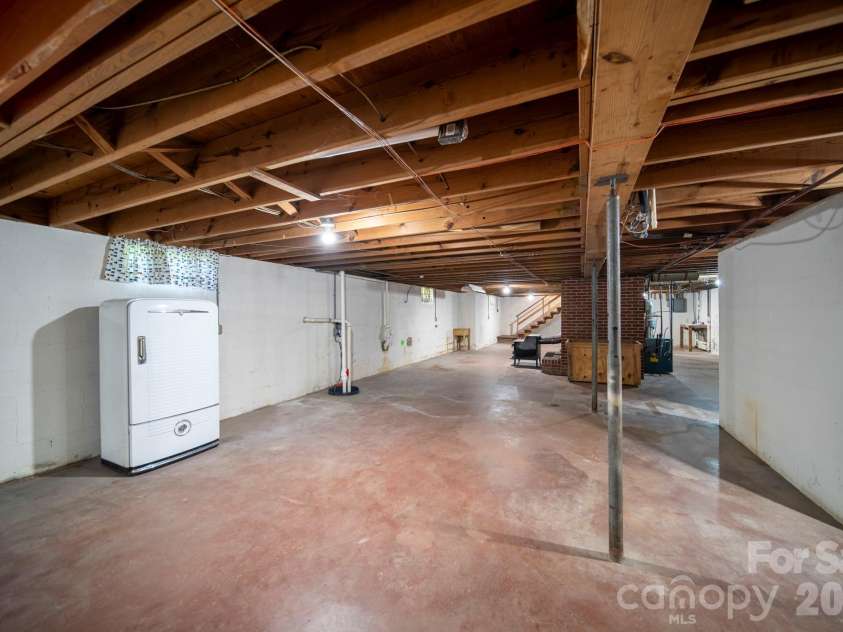 4646 Rainbow Drive, Kannapolis, NC 28081.  MLS# CAR4394032, YatesRealty ID 34076. Cinderblock wall on right is location of the plumbed bathroom, and functioning double-sinks can be seen beyond also on left side.