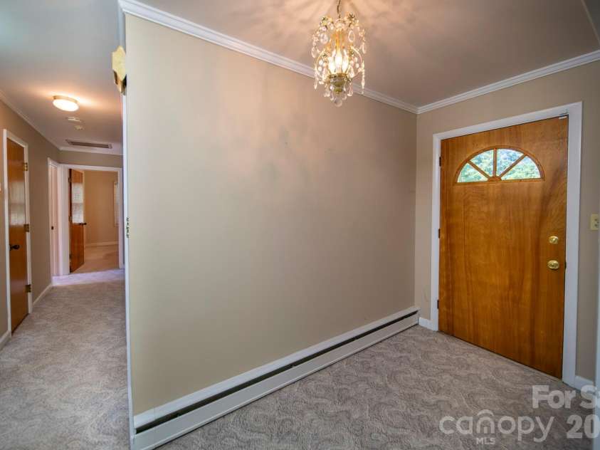 4646 Rainbow Drive, Kannapolis, NC 28081.  MLS# CAR4394032, YatesRealty ID 34076. Front Door looking down hallway to 3 bedrooms and 2 baths