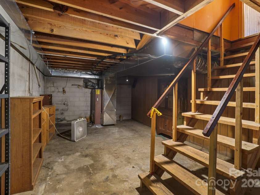 623 Edwards Cove Road, Waynesville, NC 28786.  MLS# CAR4295246, YatesRealty ID 34083. Basement storage/ workshop