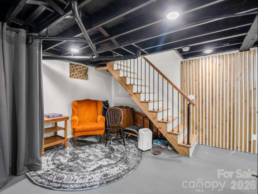 14 Penelope Street, Black Mountain, NC 28711.  MLS# CAR4394587, YatesRealty ID 34094. Speakeasy behind wooden panel wall