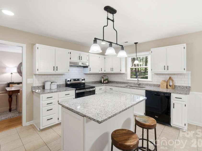 730 Fredricksburg Road, Matthews, NC 28105.  MLS# CAR4396481, YatesRealty ID 34100. Kitchen with ample cabinet space