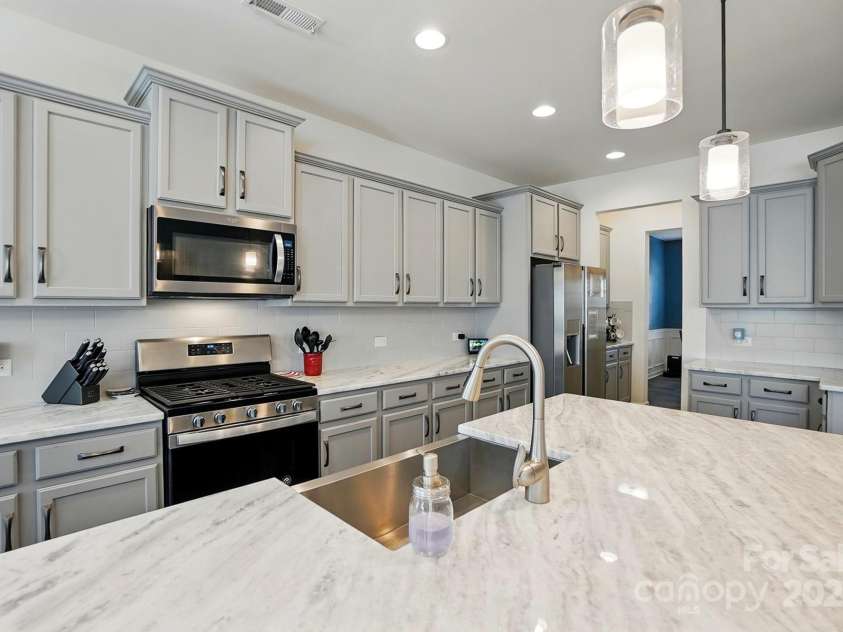 1578 Whitman Court, York, SC 29745.  MLS# CAR4247411, YatesRealty ID 34125. Stunning kitchen with a massive island is open to great room.