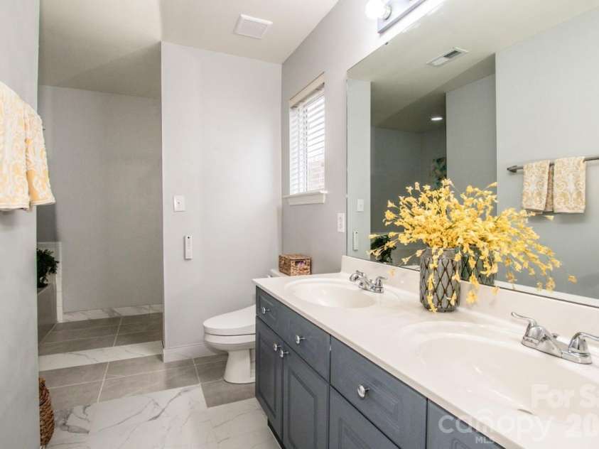 18714 Ramsey Cove Drive, Cornelius, NC 28031.  MLS# CAR4350743, YatesRealty ID 3414. Luscious Tile Flooring And TOTO Bidet