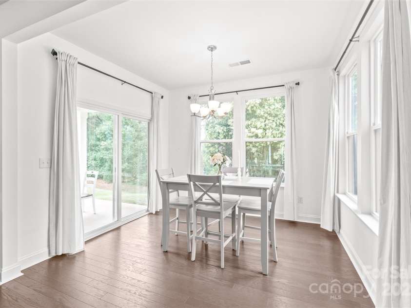 1507 Cedar Tree Drive, Belmont, NC 28012.  MLS# CAR4289479, YatesRealty ID 34147. Gorgeous breakfast area with views of backyard and trees