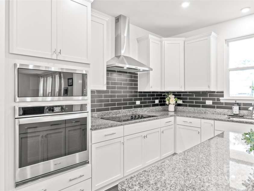 1507 Cedar Tree Drive, Belmont, NC 28012.  MLS# CAR4289479, YatesRealty ID 34147. Wall oven and upgraded hood/ vent