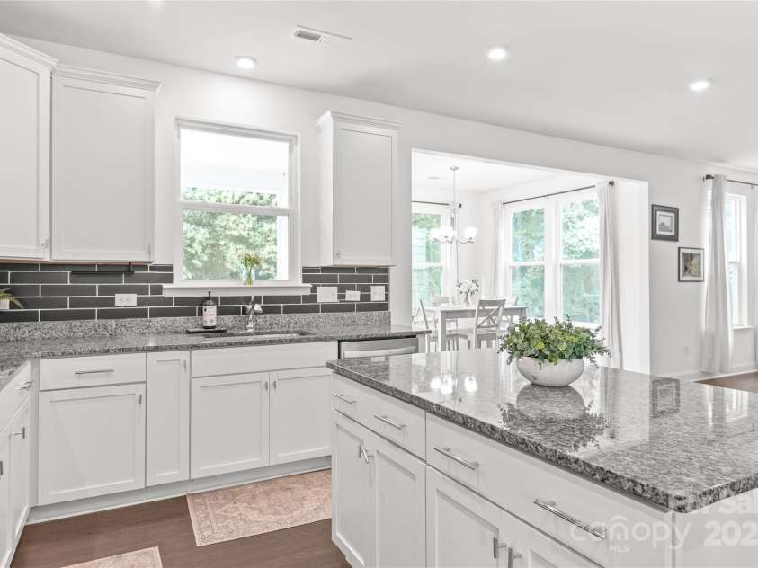 1507 Cedar Tree Drive, Belmont, NC 28012.  MLS# CAR4289479, YatesRealty ID 34147. Window over sink looks out to covered rear patio