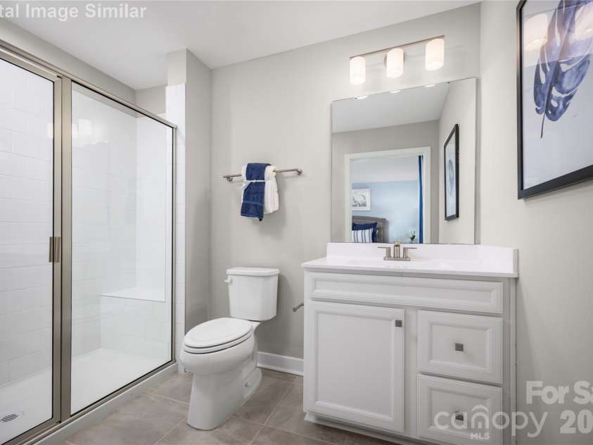 208 Linwood Estates Drive, Lexington, NC 27292.  MLS# CAR4393456, YatesRealty ID 34148. Clean lines and smart design create a space that's both spacious and soothing. The standout feature - a framed shower door that adds a touch of sophistication while keeping the space feeling open and airy. 