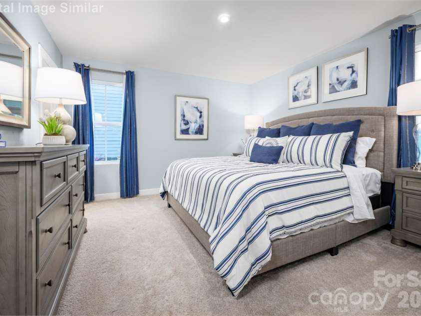 208 Linwood Estates Drive, Lexington, NC 27292.  MLS# CAR4393456, YatesRealty ID 34148. Framed by two wide windows, this serene retreat is bathed in natural light, creating a warm and peaceful ambiance from sunrise to sunset.