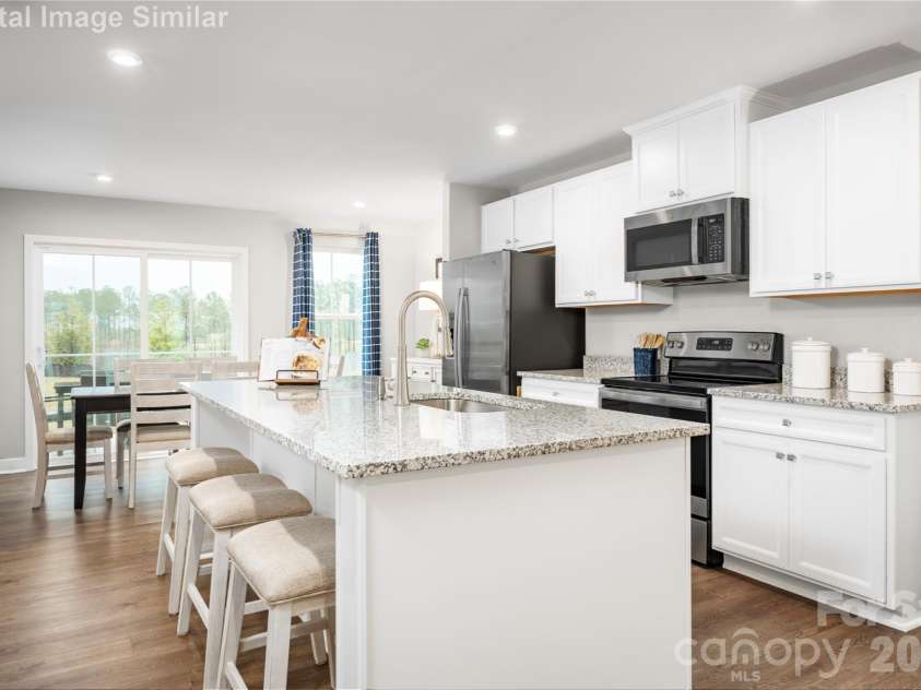 208 Linwood Estates Drive, Lexington, NC 27292.  MLS# CAR4393456, YatesRealty ID 34148.  Step into this Kitchen With gleaming granite countertops that offer both durability and style, this space is designed to be the heart of the home.