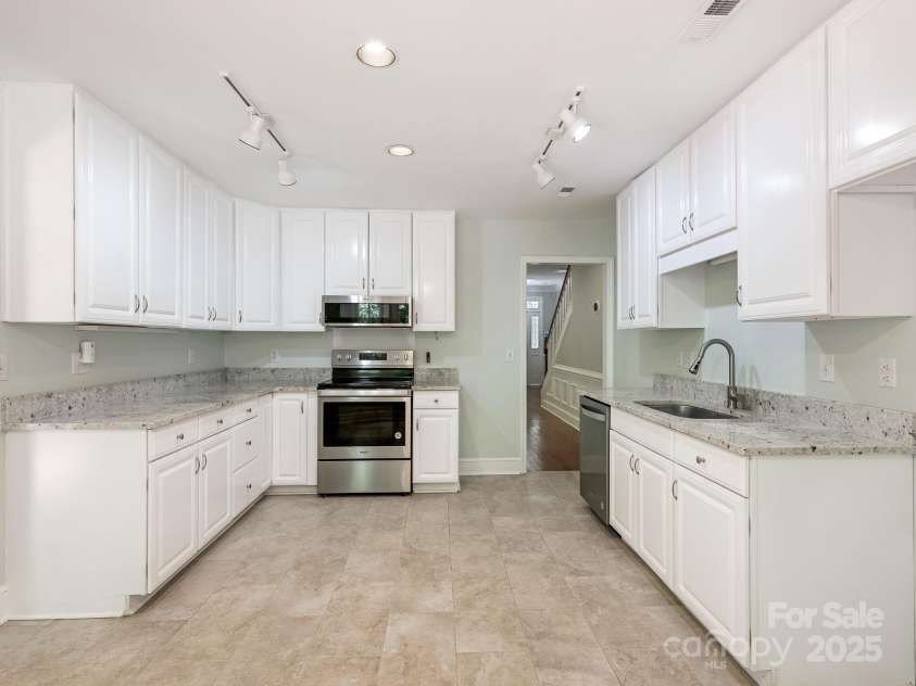 6907 Pleasant Drive, Charlotte, NC 28211.  MLS# CAR4280958, YatesRealty ID 34148. Adjacent to a bright kitchen...