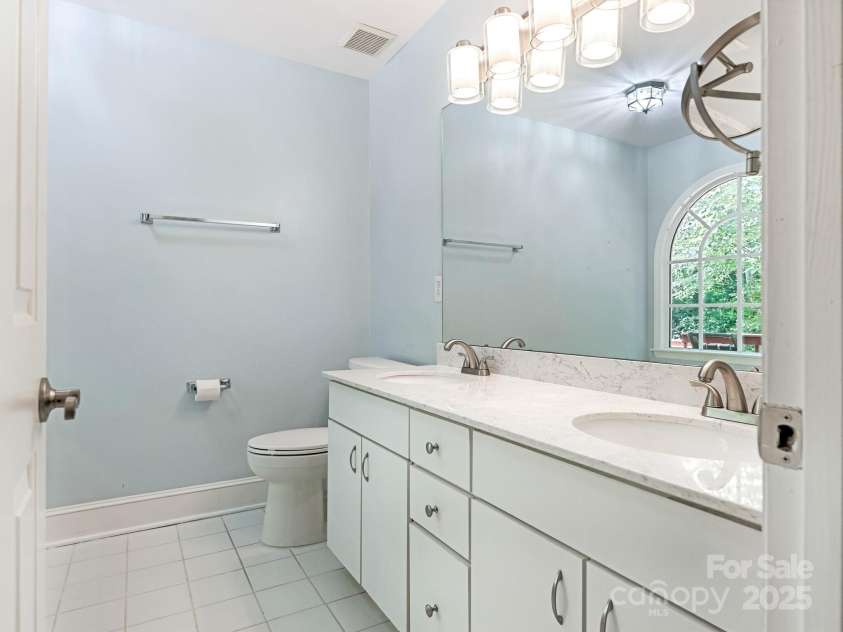 6907 Pleasant Drive, Charlotte, NC 28211.  MLS# CAR4280958, YatesRealty ID 34148. And a primary bathroom