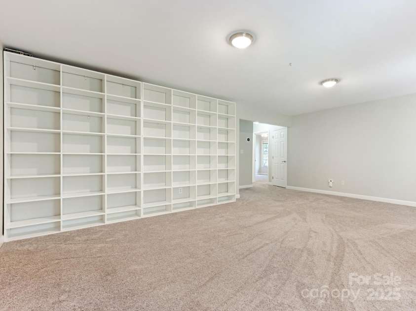 6907 Pleasant Drive, Charlotte, NC 28211.  MLS# CAR4280958, YatesRealty ID 34148. Featuring built-in shelves along one wall