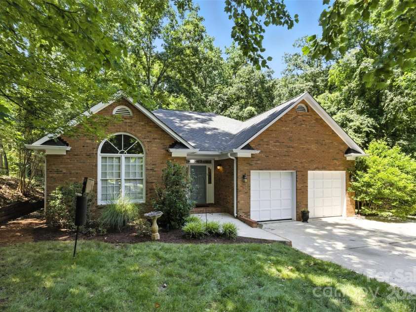 6907 Pleasant Drive, Charlotte, NC 28211.  MLS# CAR4280958, YatesRealty ID 34148. With a 2-car garage.