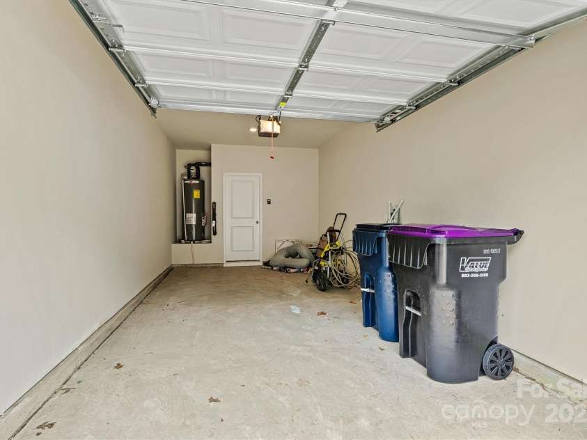 8233 Merryvale Lane, Charlotte, NC 28214.  MLS# CAR4293433, YatesRealty ID 34155. Don’t miss the added convenience of a one-car garage and private driveway—offering secure parking and extra space for guests or everyday ease