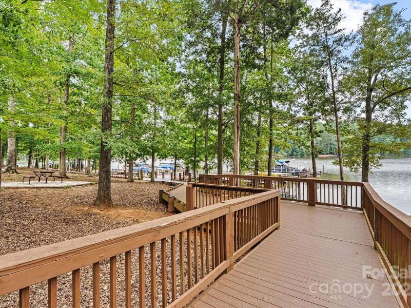 8233 Merryvale Lane, Charlotte, NC 28214.  MLS# CAR4293433, YatesRealty ID 34155. Dynamic blend of amenities for all ages and interests—from scenic walking trails and playgrounds to inviting gathering spaces. Enjoy direct lake access with paddleboard and kayak storage, easy entry points for water ac
