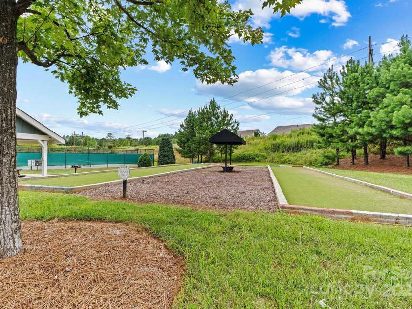 8233 Merryvale Lane, Charlotte, NC 28214.  MLS# CAR4293433, YatesRealty ID 34155. The community also features bocce ball courts—perfect for laid-back competition, socializing with neighbors, and enjoying the outdoors in a fun, relaxed setting