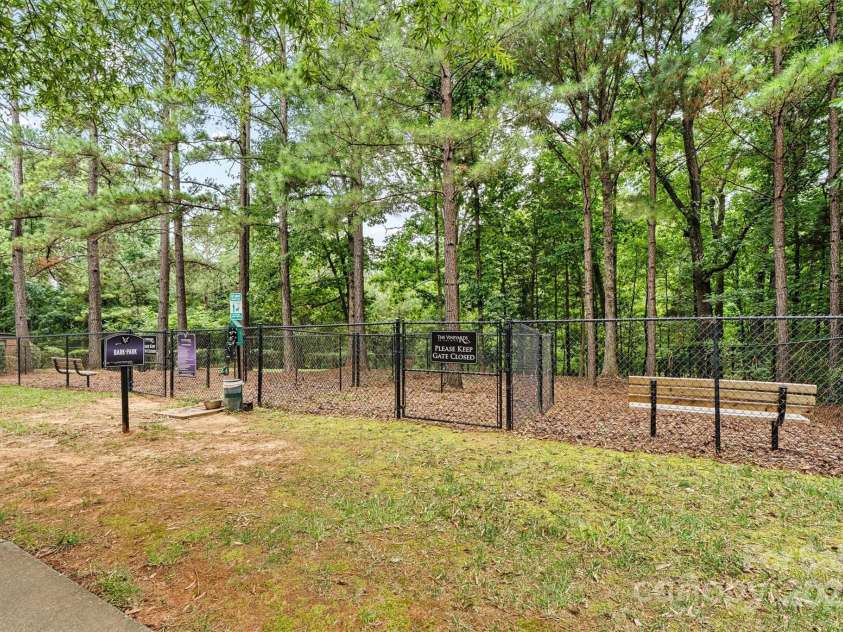 8233 Merryvale Lane, Charlotte, NC 28214.  MLS# CAR4293433, YatesRealty ID 34155. The community includes a gated dog park—providing a safe, open space for your furry friends to run, play, and socialize while you connect with fellow pet owners