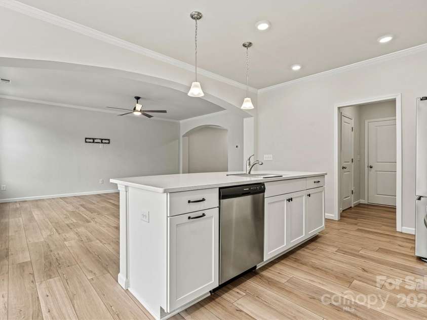 8233 Merryvale Lane, Charlotte, NC 28214.  MLS# CAR4293433, YatesRealty ID 34155. The kitchen flows effortlessly into the spacious great room for open-concept living