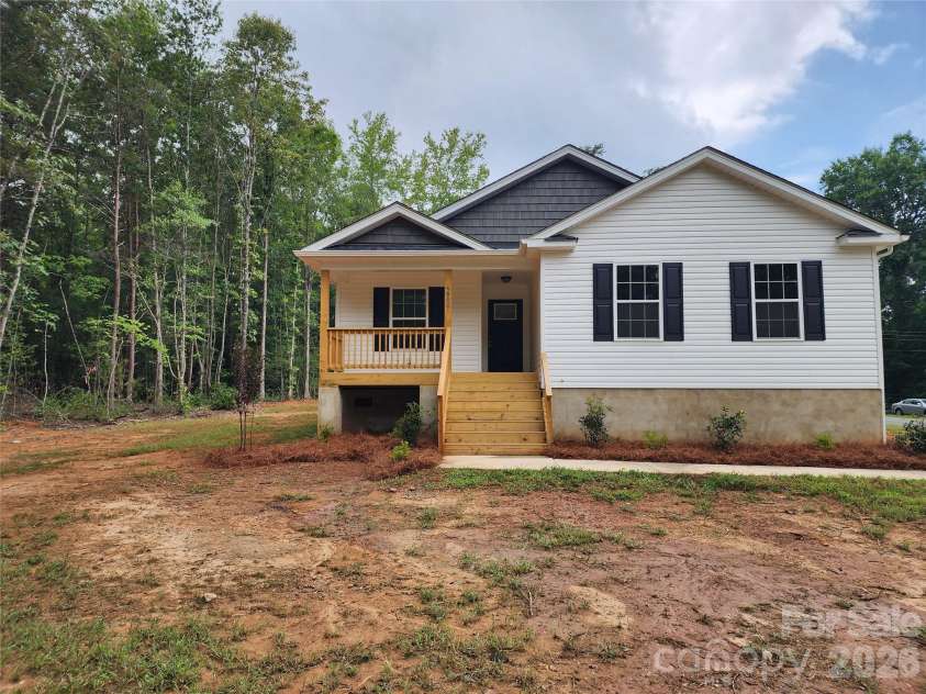 5900 Flamingo Drive, Conover, NC 28613.  MLS# CAR4415177, YatesRealty ID 34158. Front Elev w/ Covered Porch and Decorative Landscaping