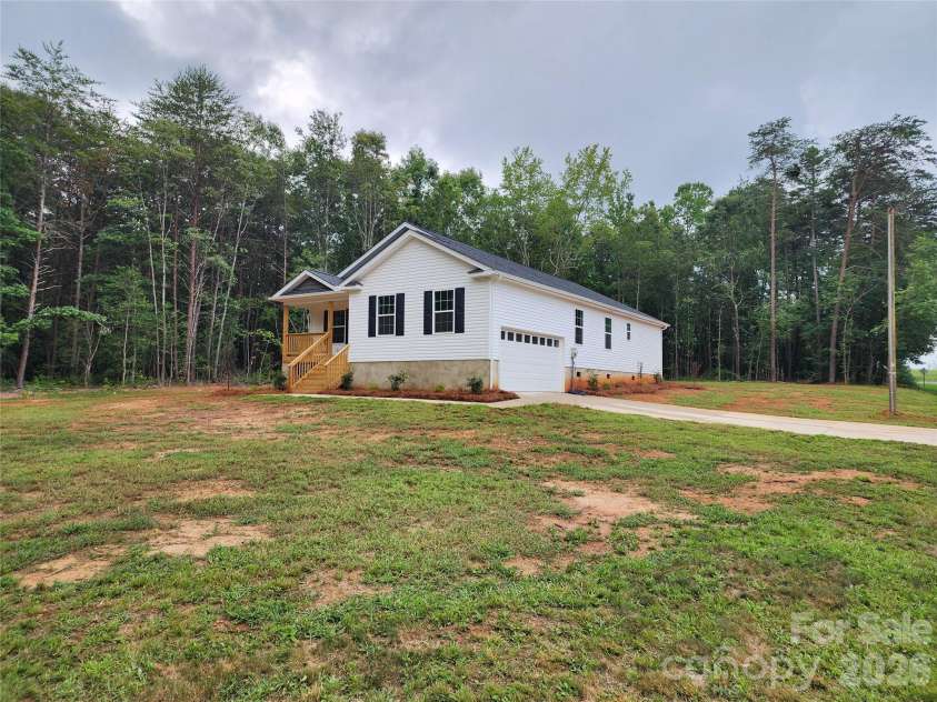 5900 Flamingo Drive, Conover, NC 28613.  MLS# CAR4415177, YatesRealty ID 34158. Front Right Elev w/ Large Yard and Decorative Landscaping