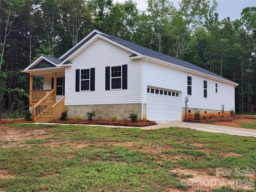 5900 Flamingo Drive, Conover, NC 28613.  MLS# CAR4415177, YatesRealty ID 34158. Front Right Elev w/ Large Yard and Decorative Landscaping