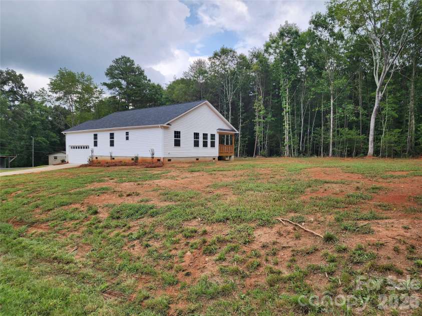 5900 Flamingo Drive, Conover, NC 28613.  MLS# CAR4415177, YatesRealty ID 34158. Rear Right Elev w/ Large Yard, Decorative Landscaping and Covered Rear Deck