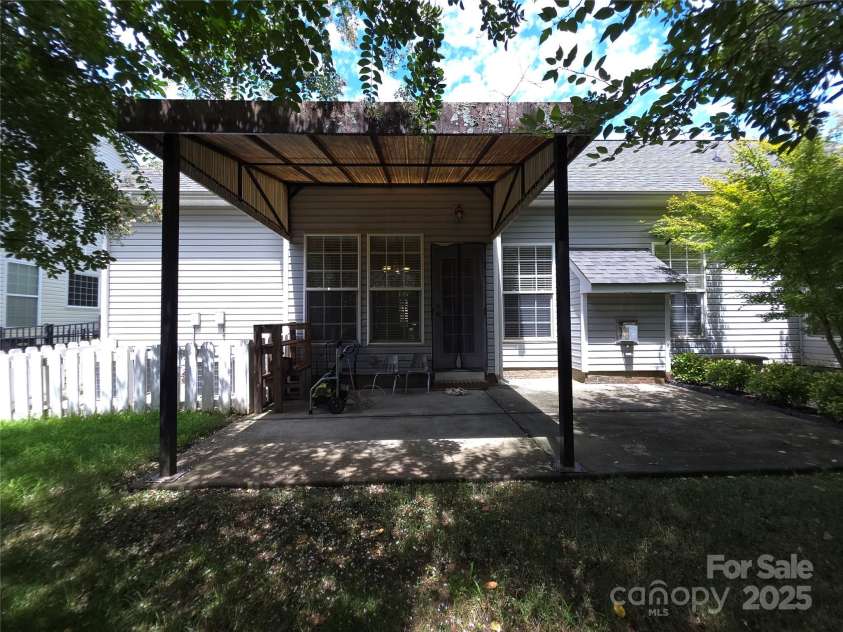5933 Kirkwynd Commons Drive, Charlotte, NC 28278.  MLS# CAR4291416, YatesRealty ID 34162. Rear porch with cover.
