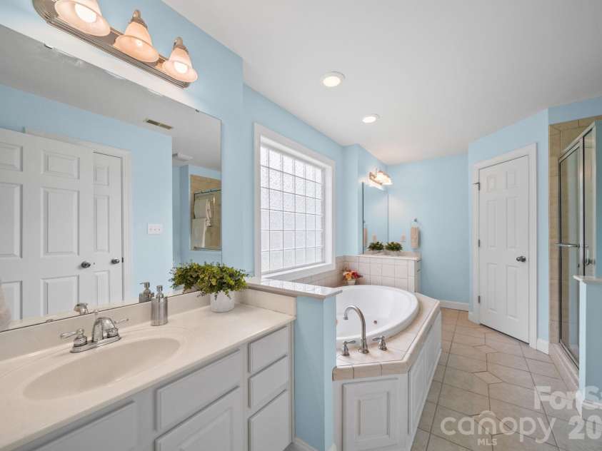 1042 Marguerite Drive, Lowell, NC 28098.  MLS# CAR4397338, YatesRealty ID 34172. Primary bath